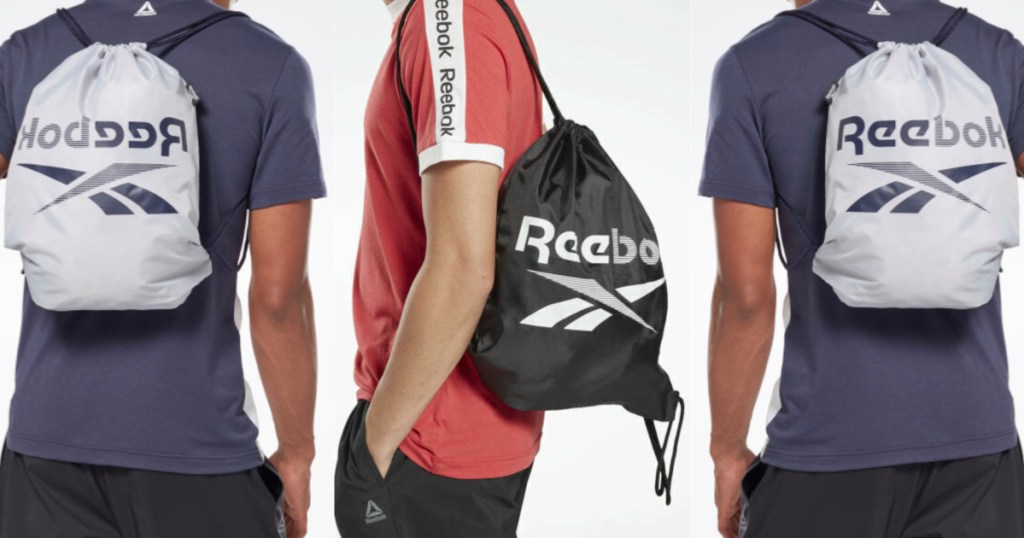 man in red shirt with black logo gym bag and two men in blue top with silver logo gym bag