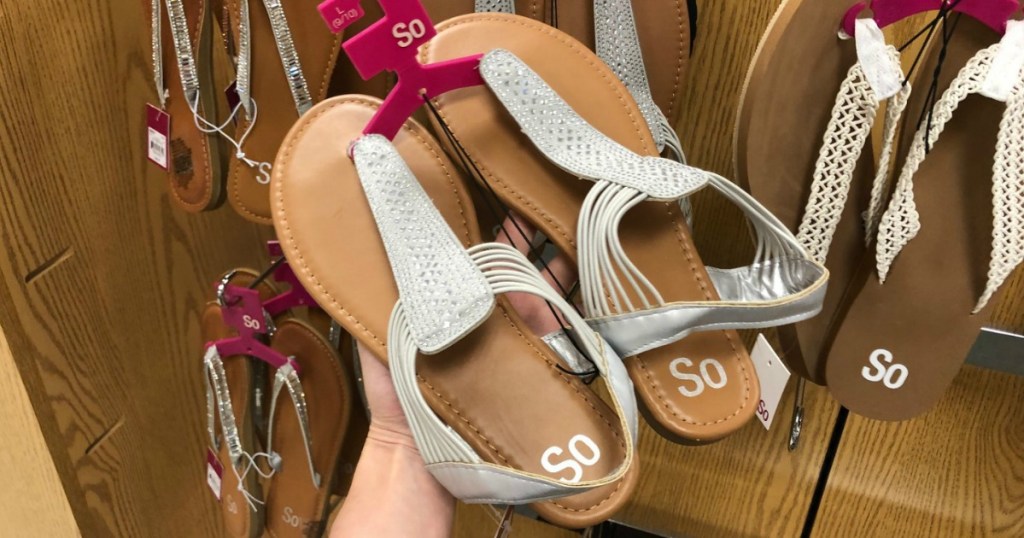 Women's silver beaded sandals in hand