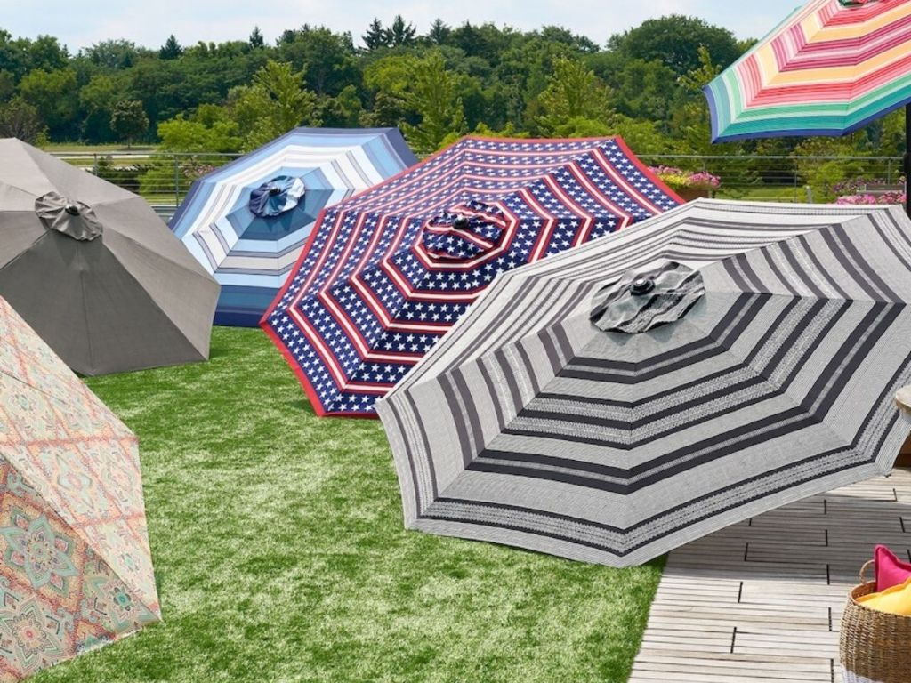 six 9-ft. tiltable umbrellas open on display outside