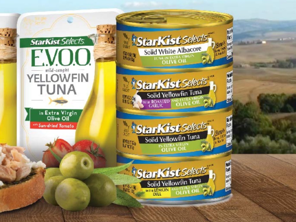 Cans of Starkist Tuna Stacked next to a pile of olives