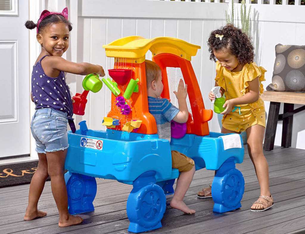 kids playing with a toy car