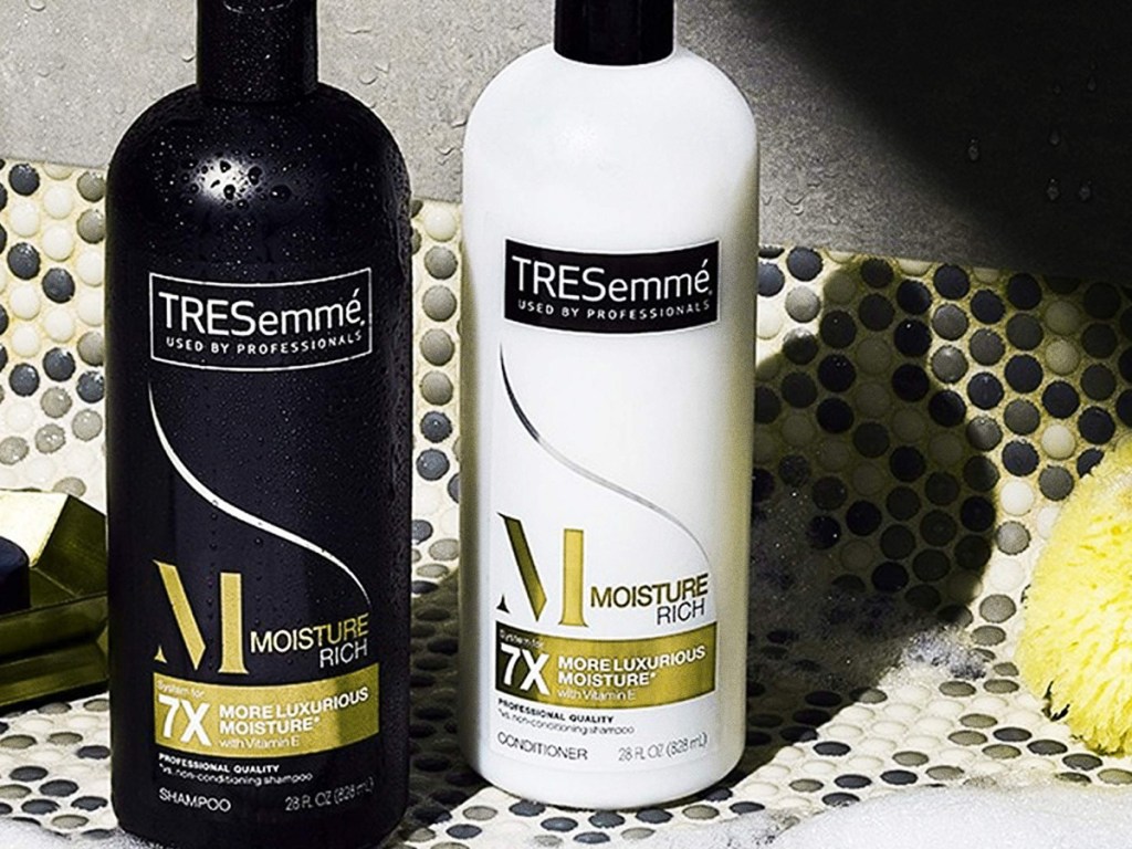 TRESemme shampoo and conditioner bottles sitting next to each other 