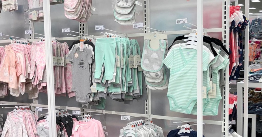large hanging rack of baby clothes in store at target 