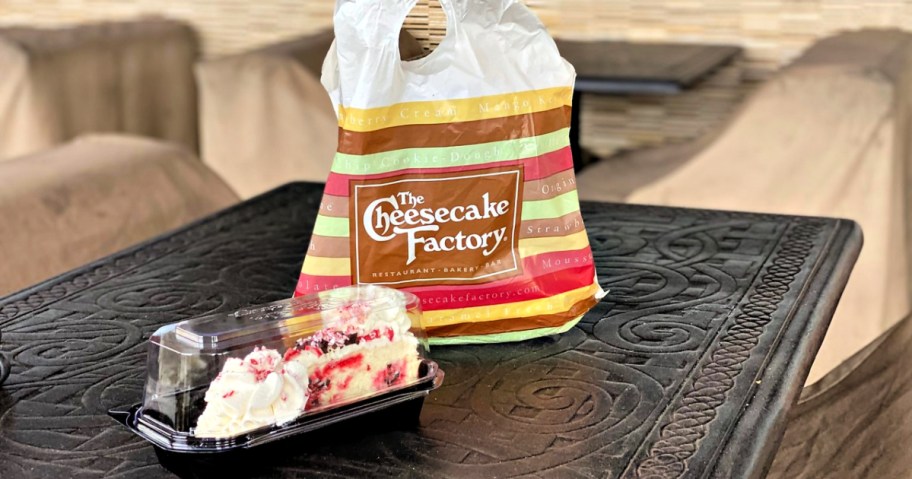 The Cheesecake Factory togo bag with cheesecake in take out container