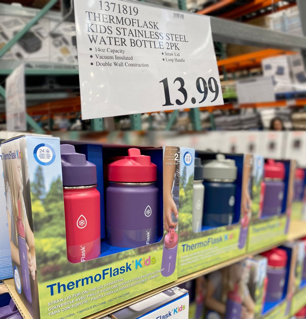 store display of two packs of kids water bottles in pink and purple colors