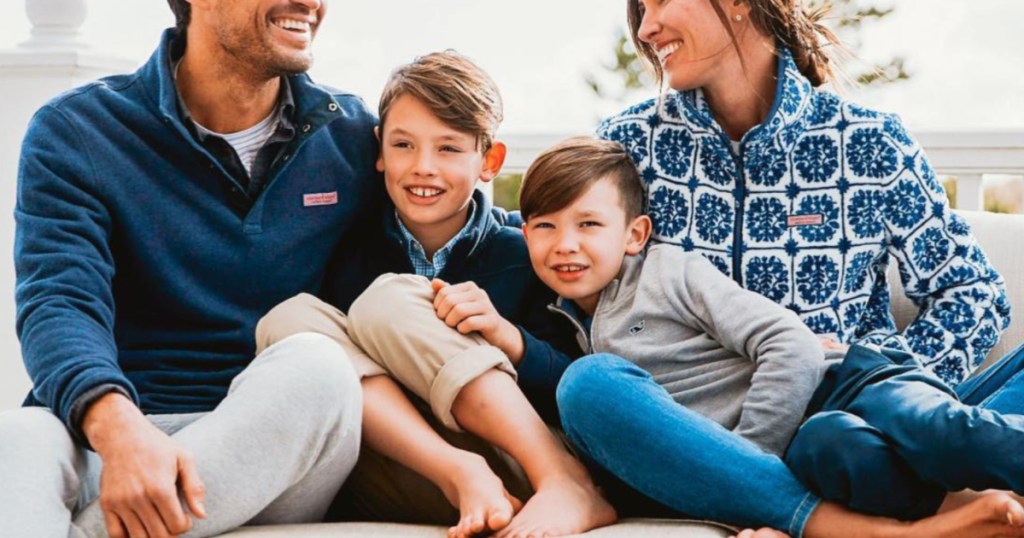 family sitting on a couch snuggling together