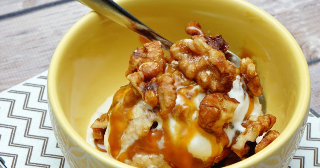 bowl of ice cream with walnuts on it