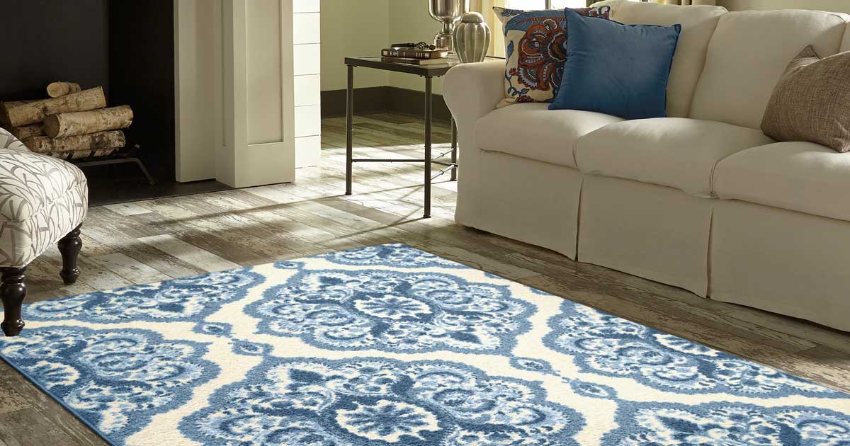 blue and white medallion area rug in a living room