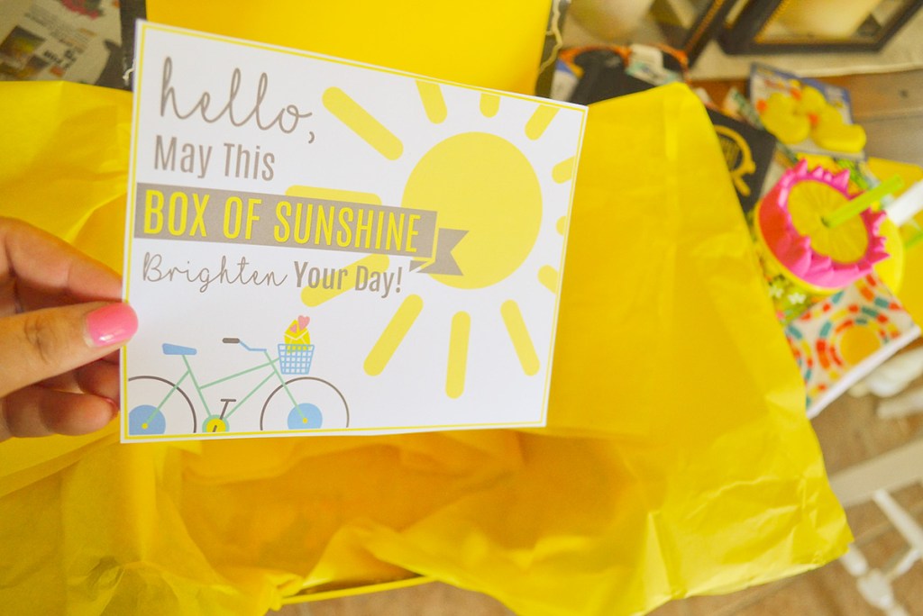 hand holding box of sunshine card