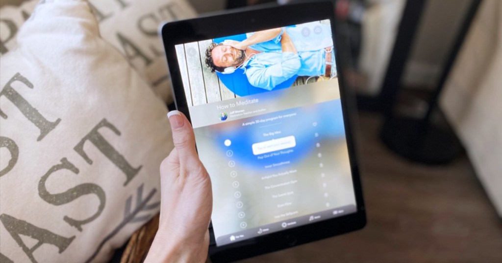 calm app on ipad in hand in living room