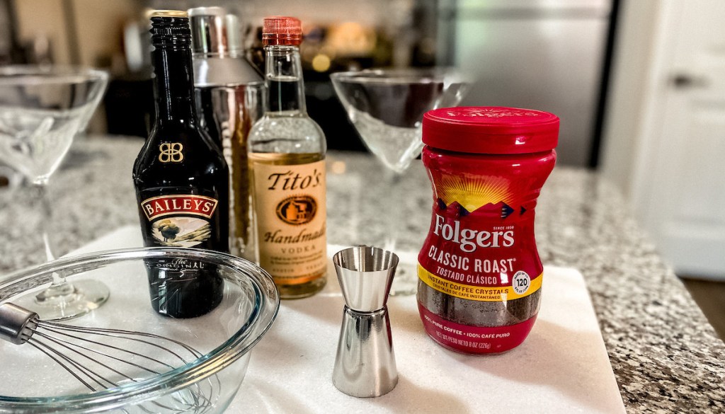 dalgona martini ingredients of baileys titos and folgers on kitchen counter with bowl