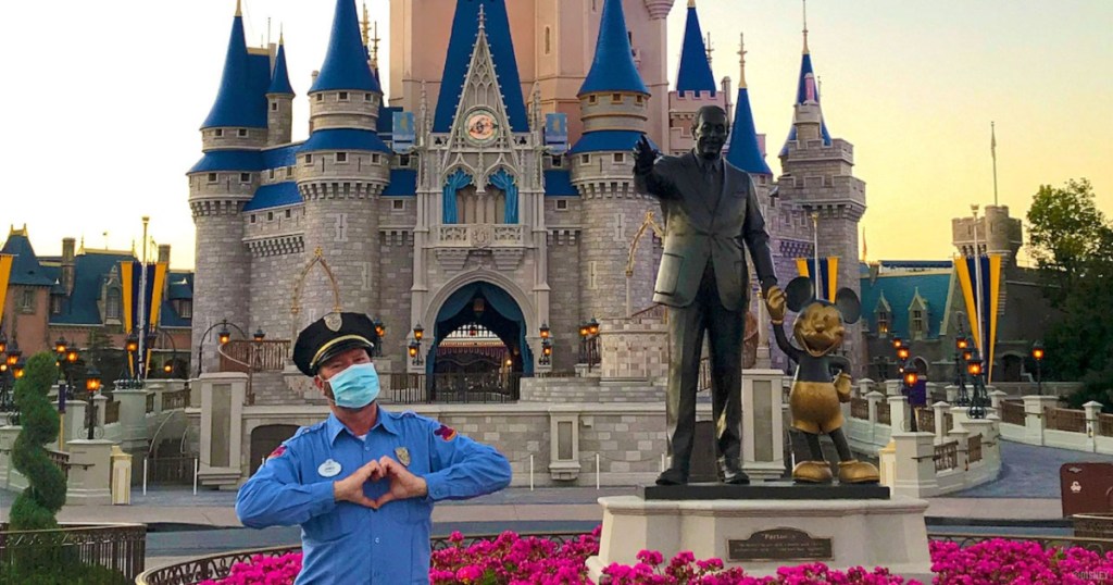 masked security guard in front of Cinderella's castle