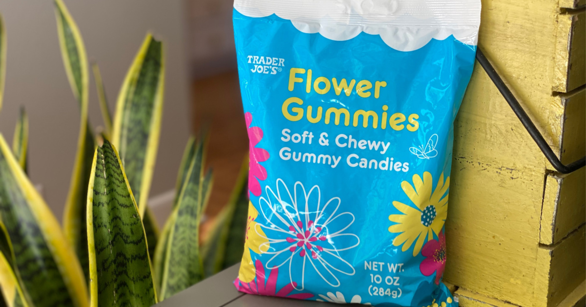 flower gummies in bag next to planter and plant