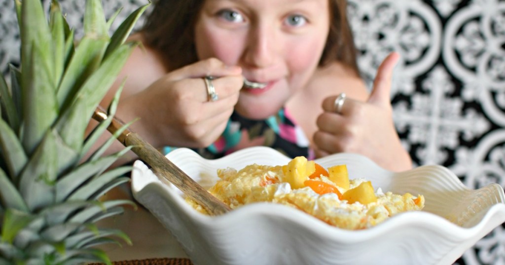 girl eating pineapple fluff salad