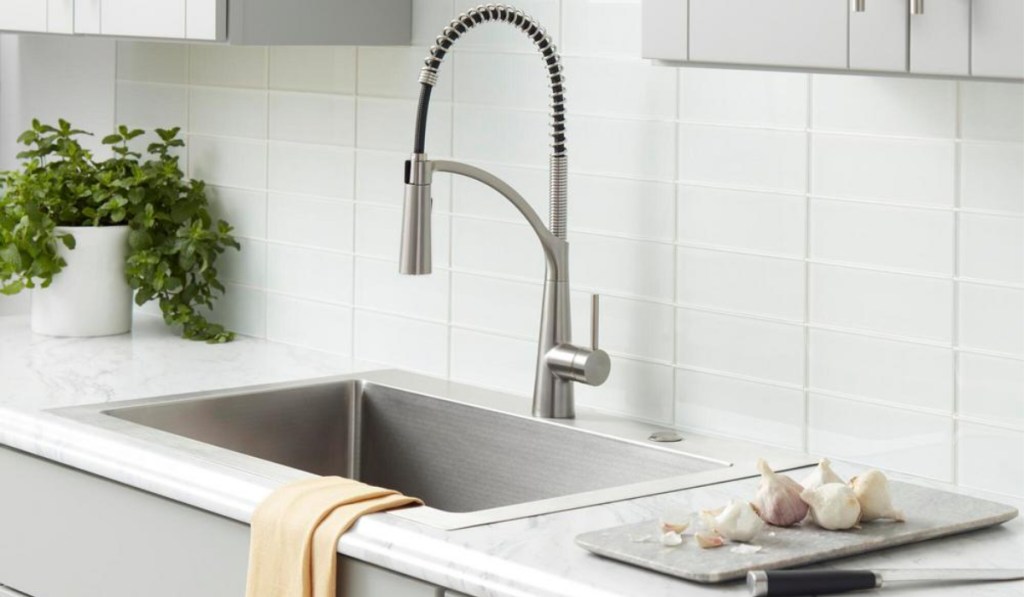 glacier bay commercial style faucet in all white kitchen