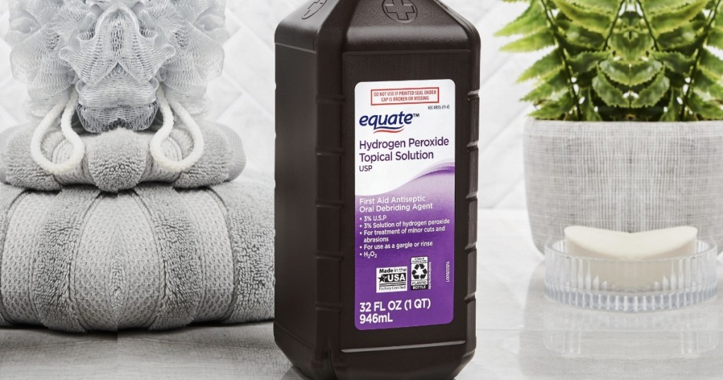 hydrogen peroxide on a bathroom counter with towels