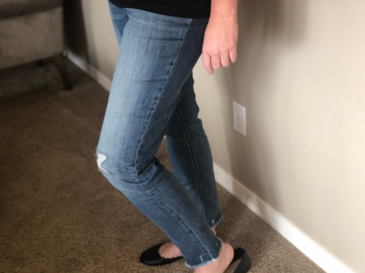 woman wearing jeans and black flats