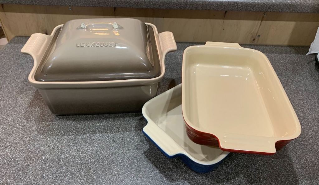 Three baking dishes sitting on counter to