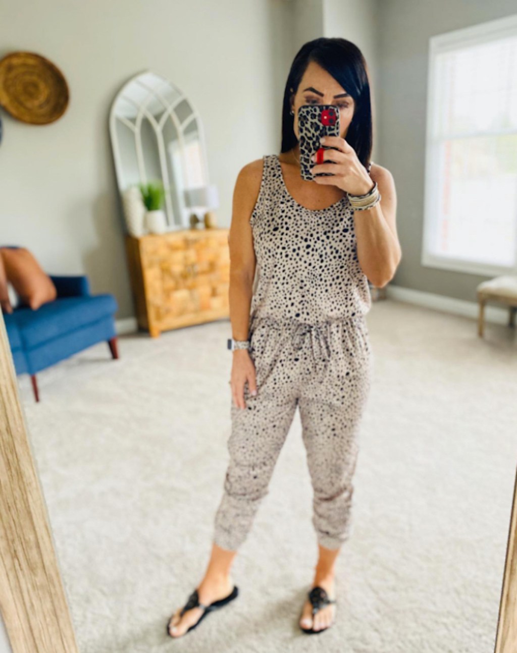 woman taking selfie in mirror wearing leopard jumpsuit womens jumpsuits and rompers