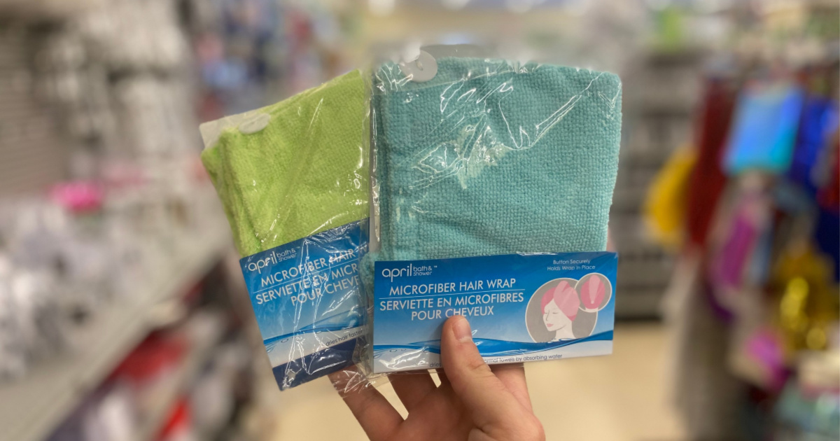 hand holding two packs of microfiber hair towels