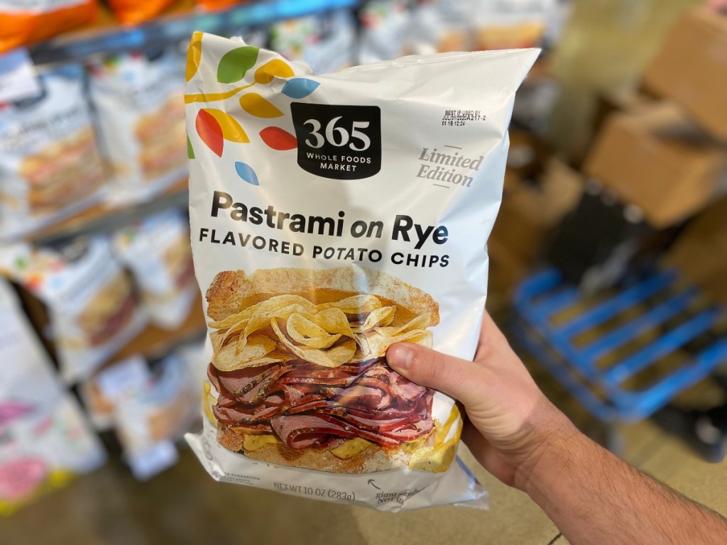 hand holding bag of Pastrami on Rye Chips