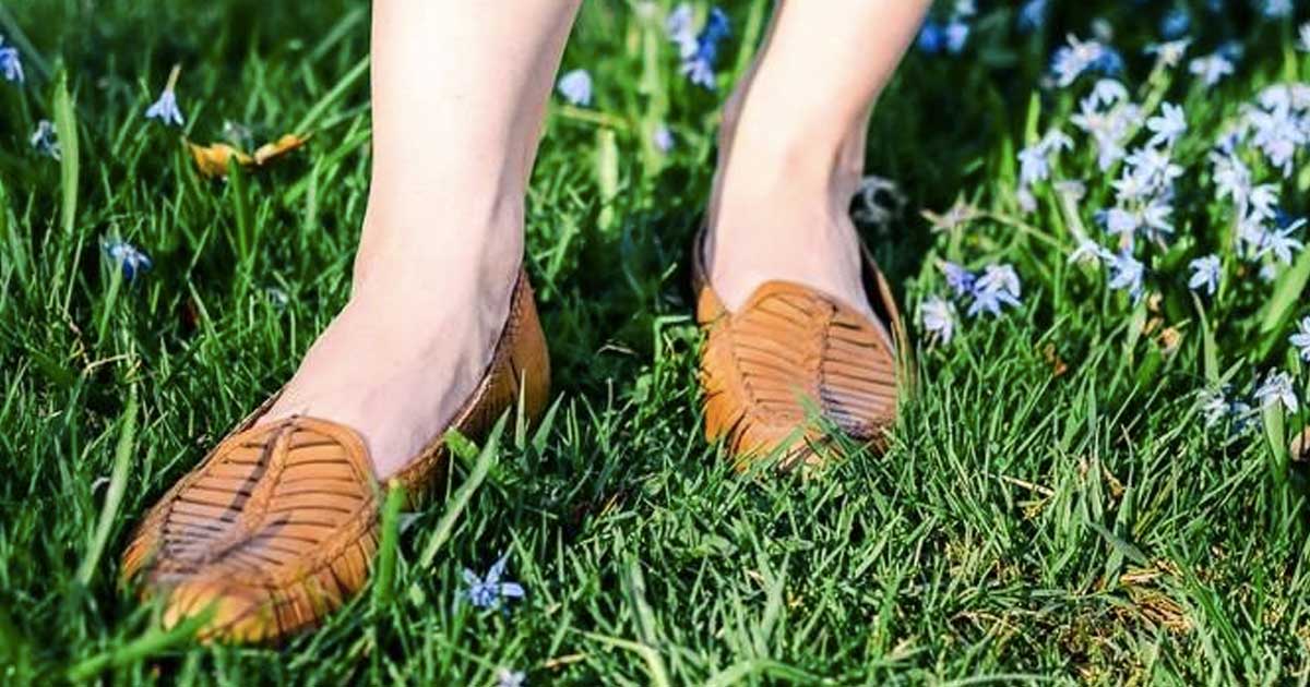 woman wearing sandals in the grass