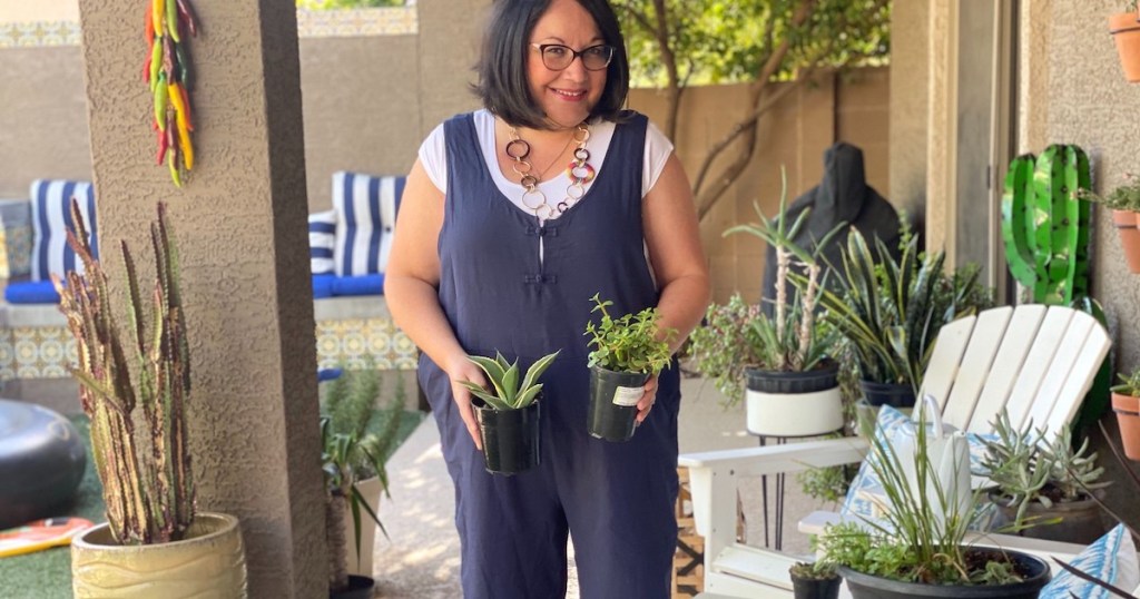 woman holding plants outside on porch womens jumpsuits and rompers