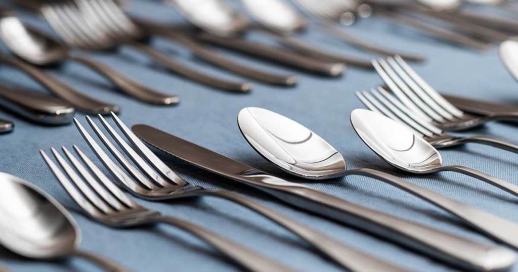 silverware on blue tablecloth