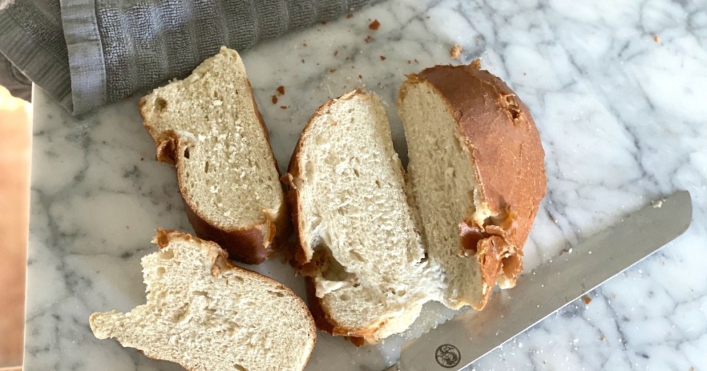 slicing revived french loaf of bread