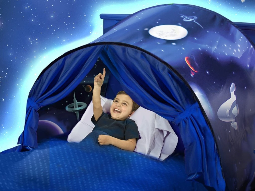 boy inside space tent