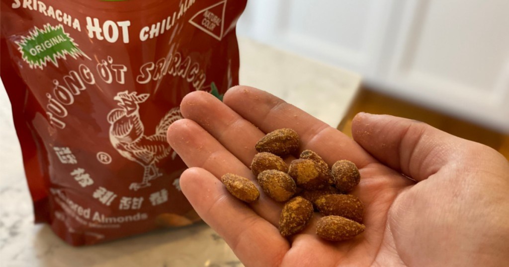 individual huy fong almonds in hand bag in background