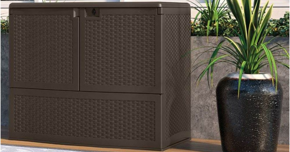 brown deck box next to plant outdoors