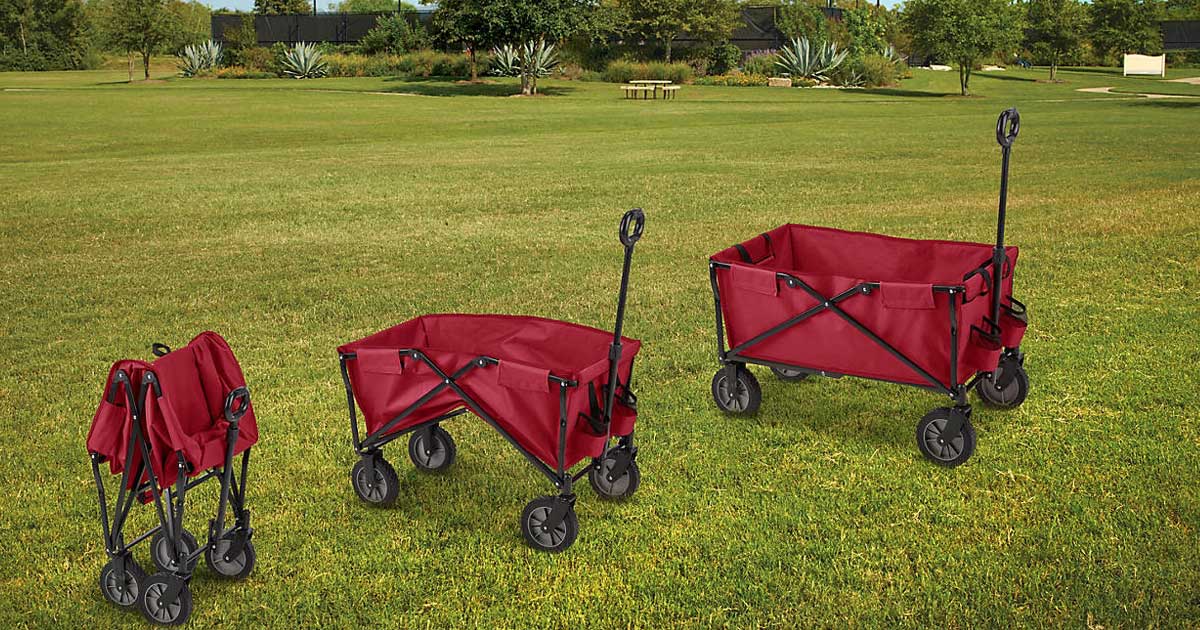 red utility wagons on a grass field in various stages of folding