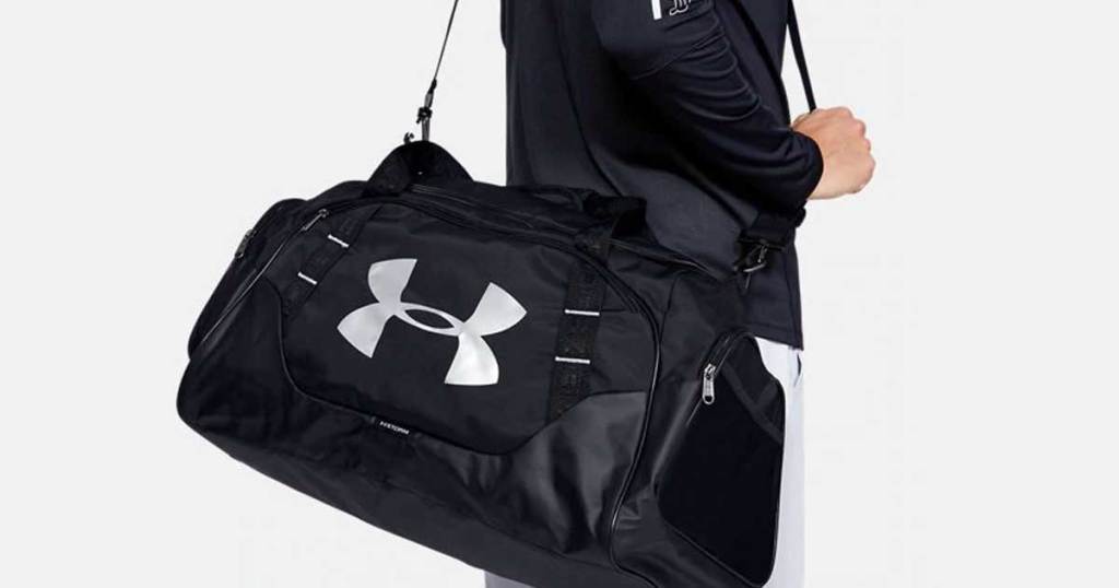 man holding gym bag 