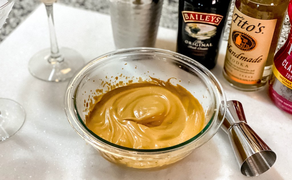 clear bowl with brown whipped baileys titos and folgers