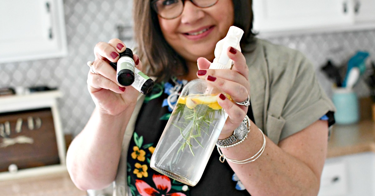 woman holding DIY Vinegar Cleaner