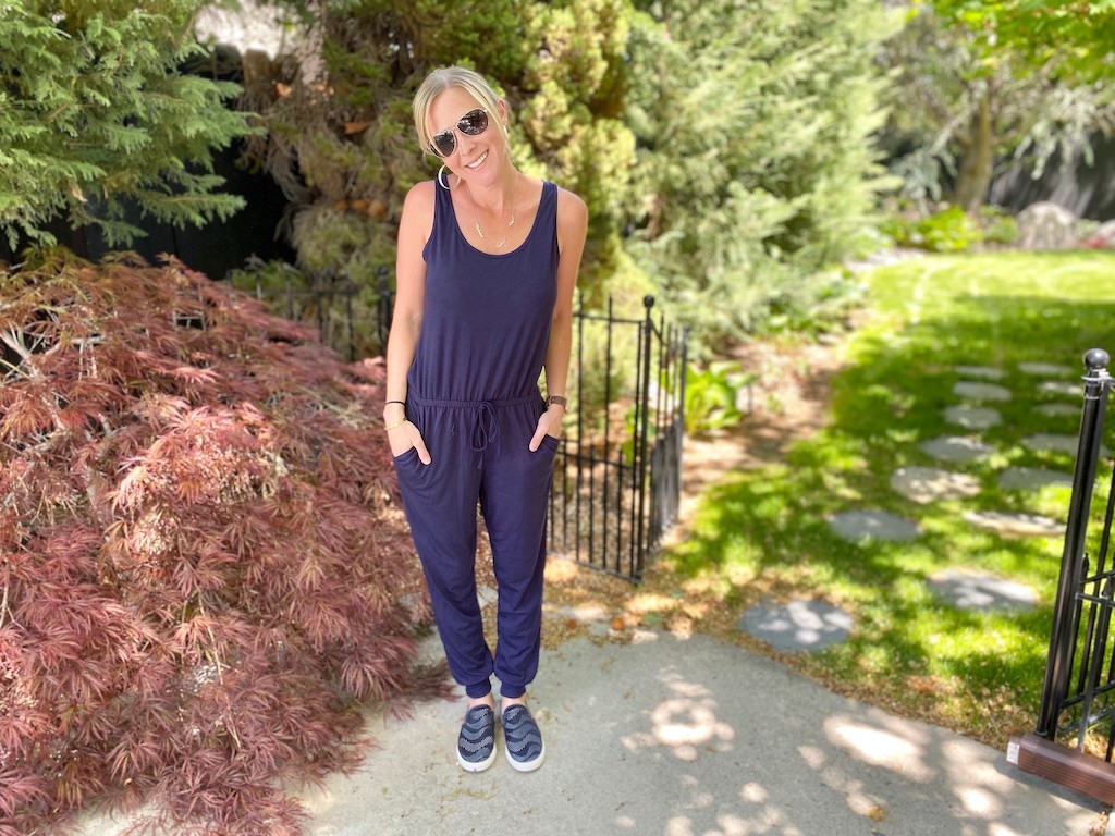 woman wearing blue jumpsuit outside 