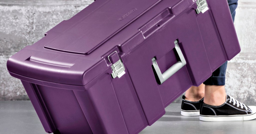 woman pulling Sterilite Footlocker on wheels