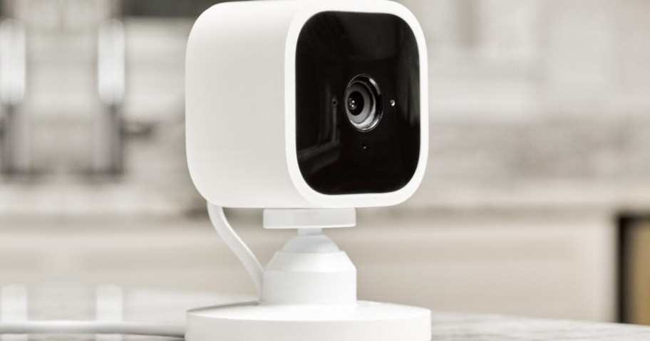 white security camera on counter in home