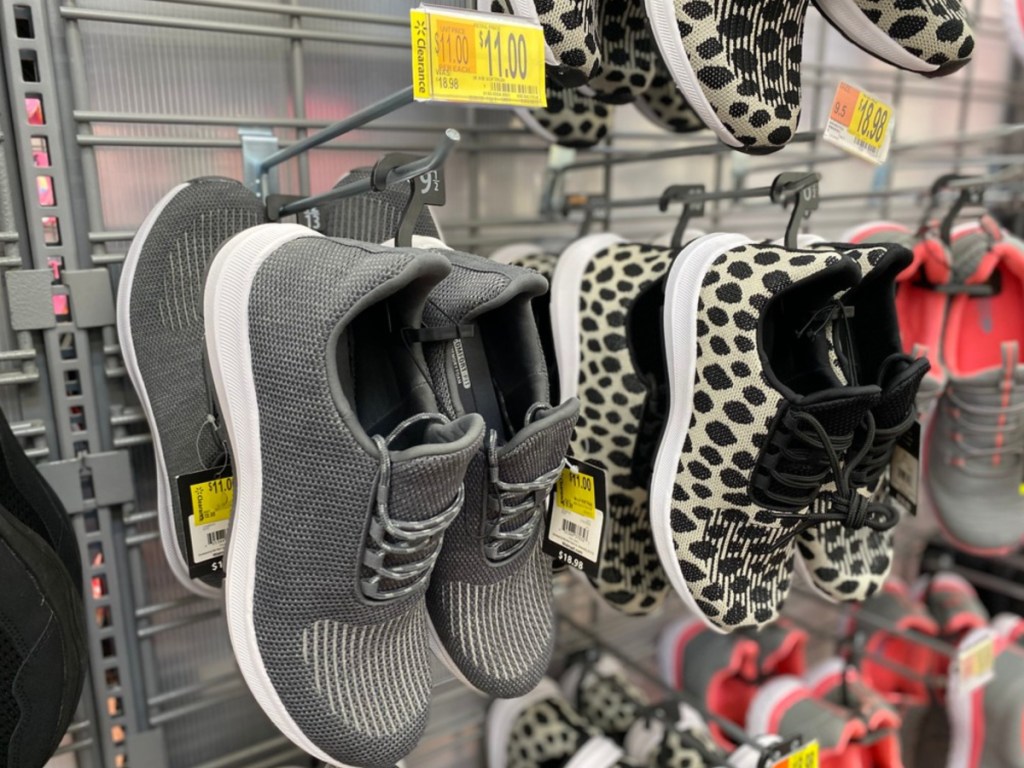 women's gray sneakers hanging in store