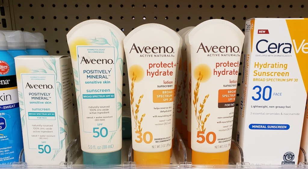 row of Aveeno sunscreen on a shelf