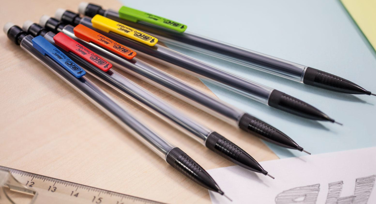 five mechanical pencils on table