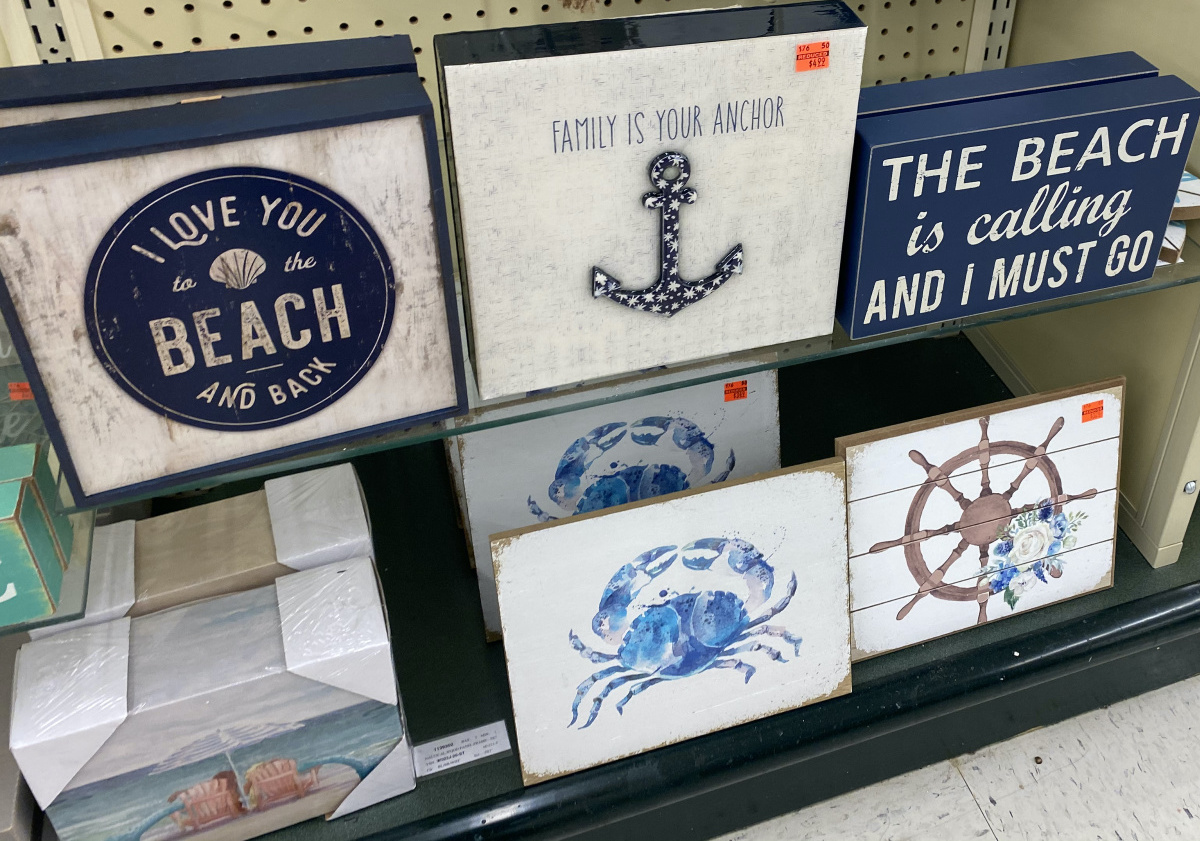 "Family Is Your Anchor" wall decor on store shelf with other beach-themed decor
