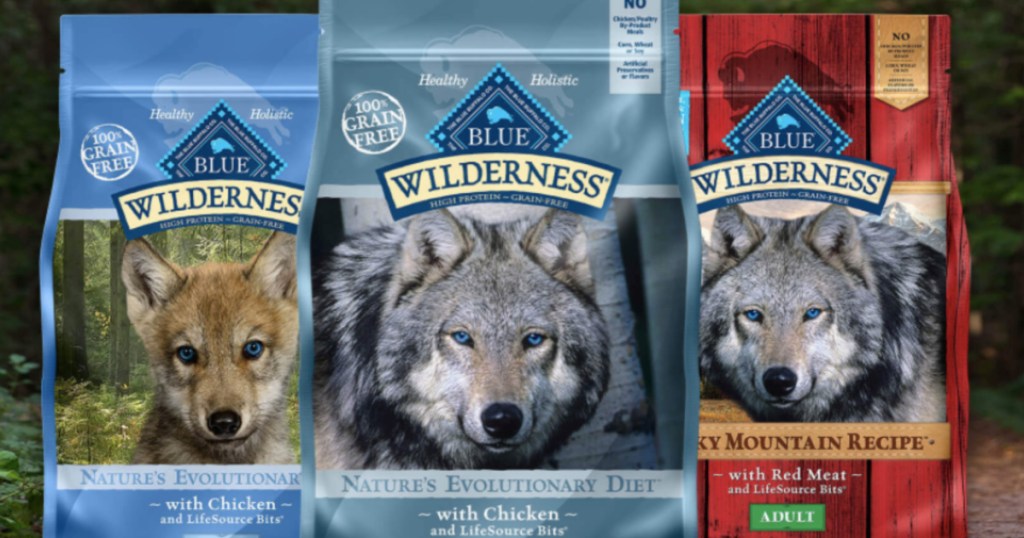 three bags of dog food with outdoor background