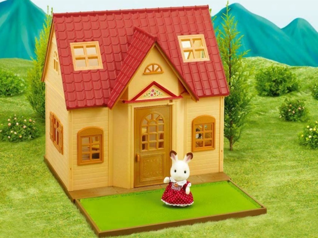 Calico Critters cottage on grass scene with rabbit figure