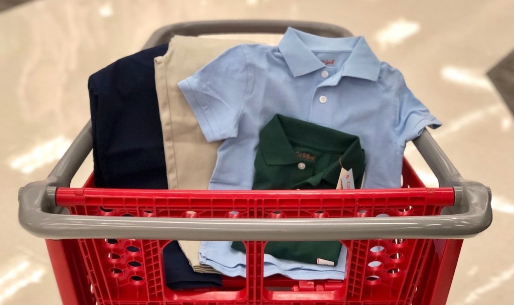 light blue and dark green cat and jack uniform polo and khaki and dark blue uniform pants in target cart