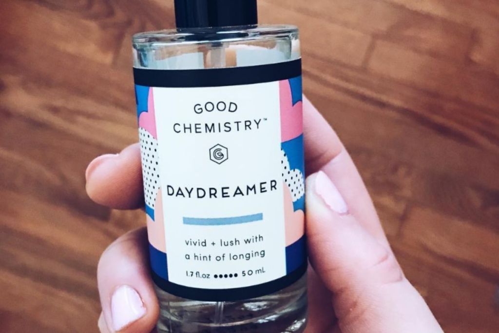 Hand holding daydreamer perfume