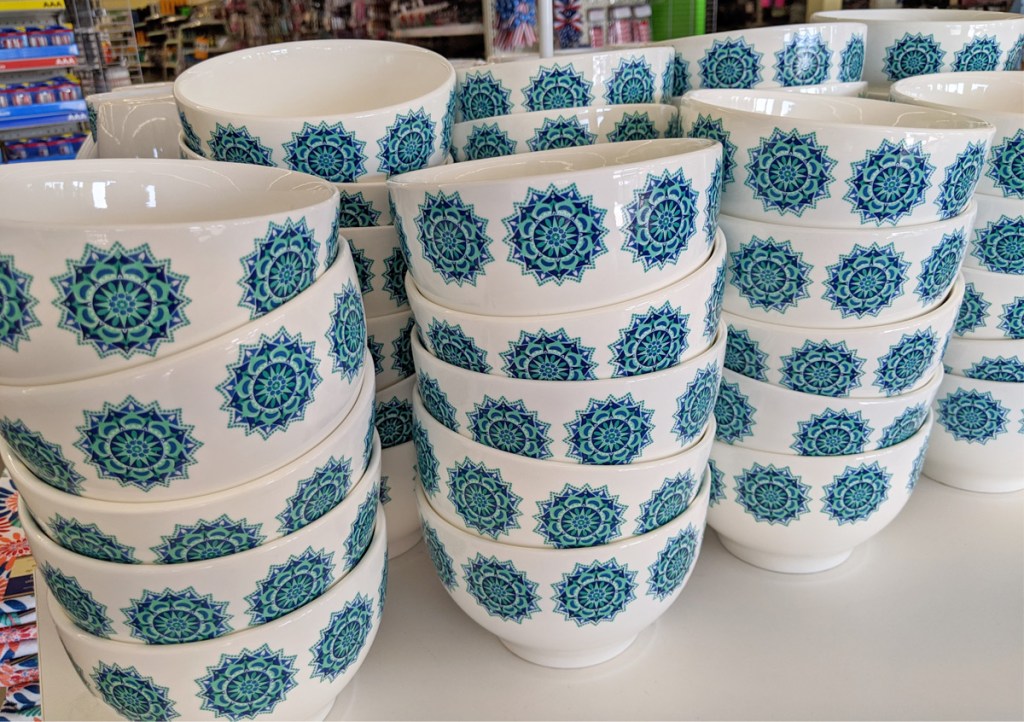 store display with blue and turquoise mediterranean themed bowls