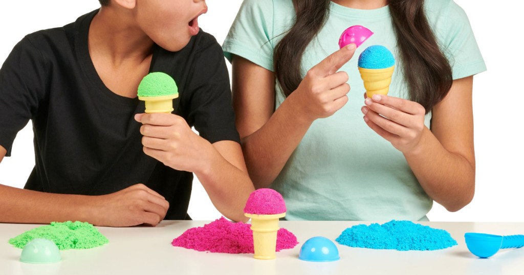 two kids playing with colorful foam ice cream kit