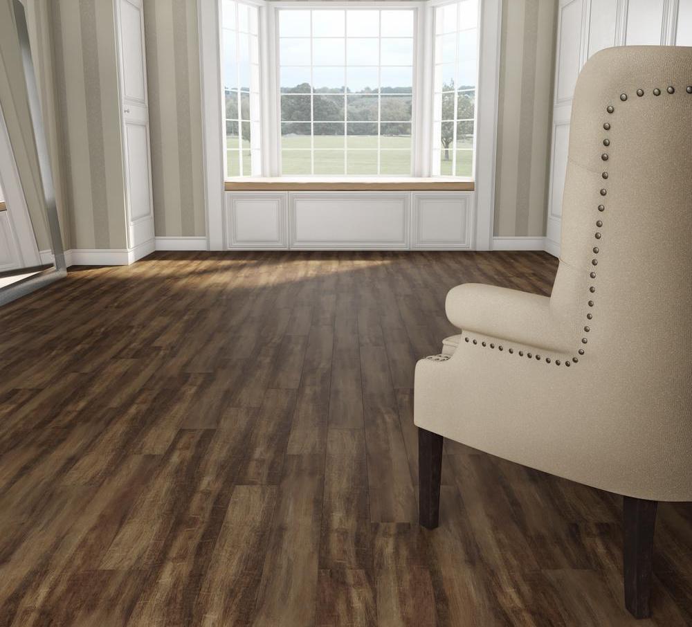 living room with large window and cream chair